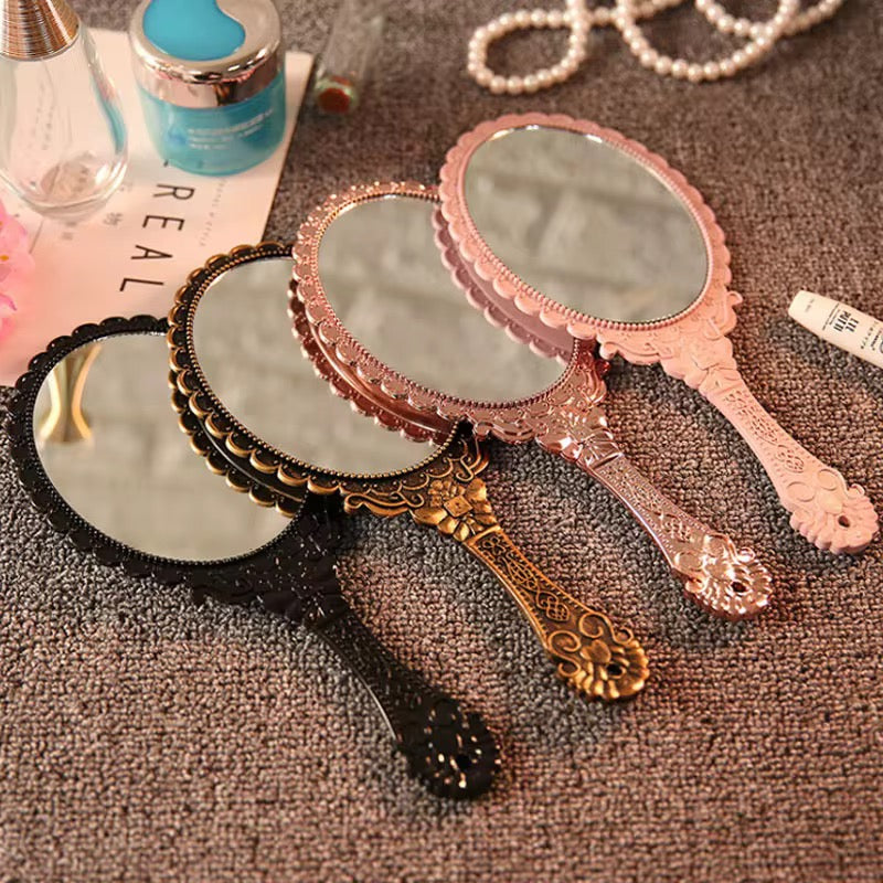 Hold Beauty—Frame Grace Vintage Handheld Mirror – Elegance in Every Detail Crafted with a sculpted plastic frame