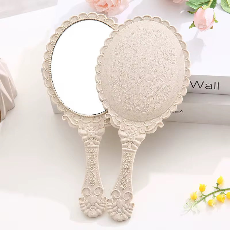 Hold Beauty—Frame Grace Vintage Handheld Mirror – Elegance in Every Detail Crafted with a sculpted plastic frame