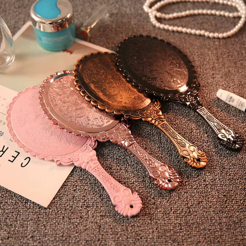 Hold Beauty—Frame Grace Vintage Handheld Mirror – Elegance in Every Detail Crafted with a sculpted plastic frame